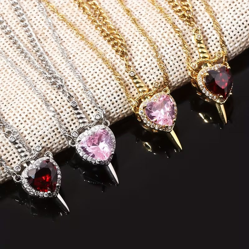 COLLAR DE PAREJA CORAZON CON ESPADA