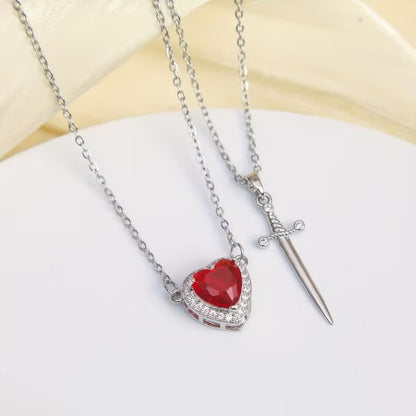 COLLAR DE PAREJA CORAZON CON ESPADA